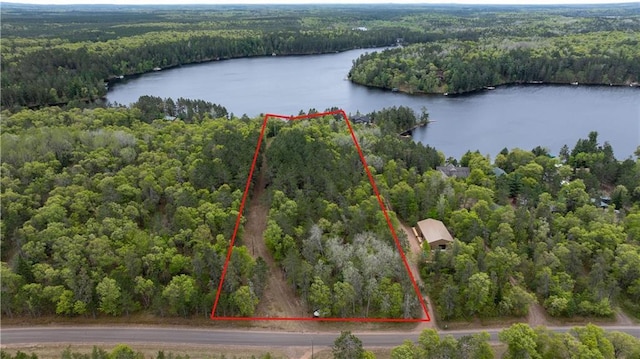 W7607 Whitetail Dr, Minong, WI 54859 - aerial view of property and surrounding area featuring a heavily wooded area, a nearby body of water, and property parcel outlined
