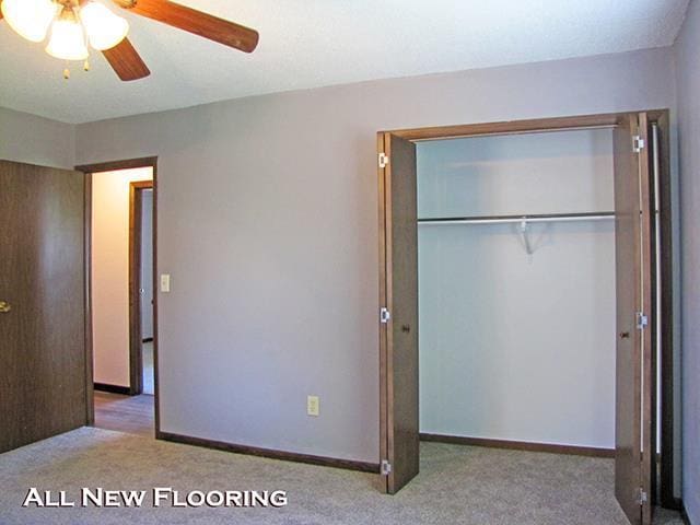 79 1st Ave, Benton, WI 53803 - unfurnished bedroom featuring carpet floors, a closet, a ceiling fan, and baseboards