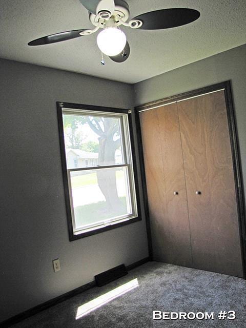 79 1st Ave, Benton, WI 53803 - unfurnished bedroom featuring carpet floors, a closet, ceiling fan, and baseboards
