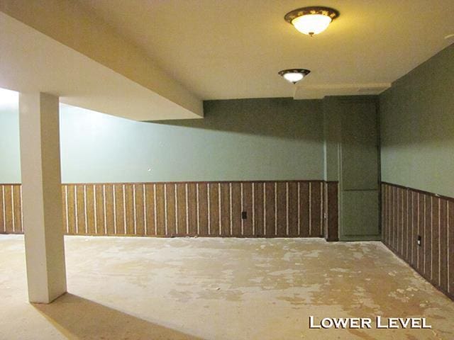 79 1st Ave, Benton, WI 53803 - finished below grade area featuring wainscoting and wood walls