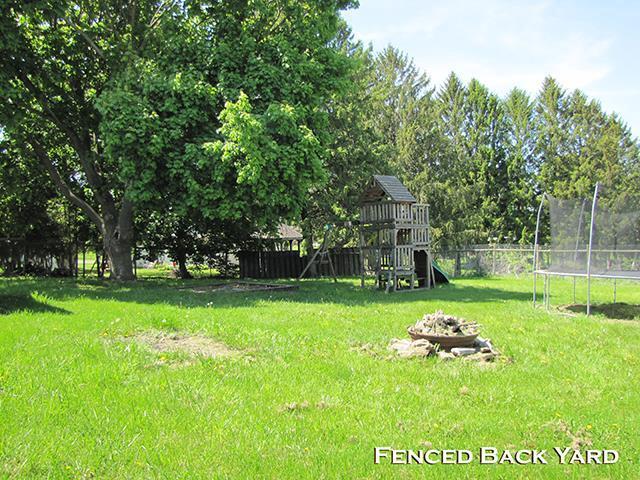 79 1st Ave, Benton, WI 53803 - view of yard with a trampoline and a playground