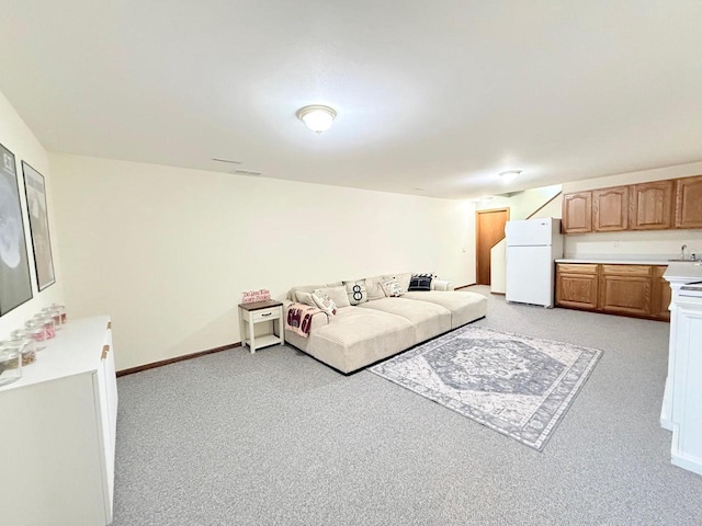 407 Overlook Ter, Marshall, WI 53559 - living room featuring light colored carpet and baseboards