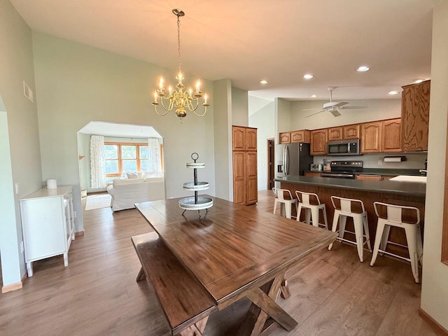 407 Overlook Ter, Marshall, WI 53559 - dining room with wood finished floors, recessed lighting, a chandelier, ceiling fan, and baseboards