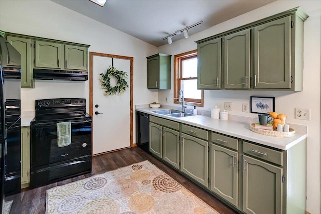 906 Spahn Dr, Waunakee, WI 53597 - kitchen featuring green cabinets, black appliances, under cabinet range hood, and a sink