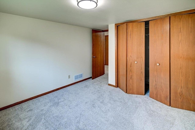 906 Spahn Dr, Waunakee, WI 53597 - unfurnished bedroom with carpet, a closet, and baseboards