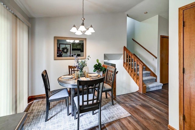 906 Spahn Dr, Waunakee, WI 53597 - dining area featuring dark wood-type flooring, a chandelier, and stairs