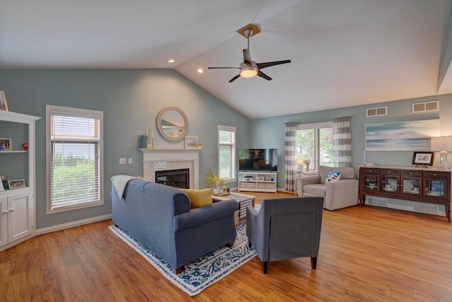 2330 Mica Rd, Madison, WI 53719 - living room featuring ceiling fan, vaulted ceiling, light wood finished floors, a glass covered fireplace, and recessed lighting