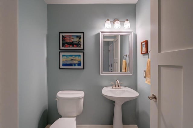 2330 Mica Rd, Madison, WI 53719 - half bathroom featuring toilet and baseboards