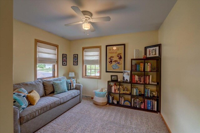 2330 Mica Rd, Madison, WI 53719 - carpeted living room featuring a ceiling fan and baseboards