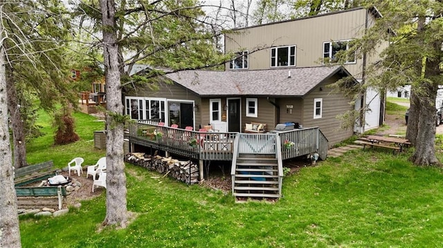 15249 W Bills Rd Unit 5, Hayward, WI 54843 - back of house featuring a lawn, a deck, and roof with shingles