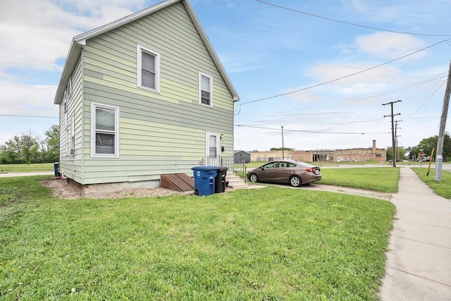 1515 Harrison St, Oshkosh, WI 54901 - view of side of property featuring a lawn