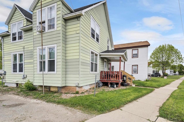 1515 Harrison St, Oshkosh, WI 54901 - view of side of home featuring a yard and cooling unit