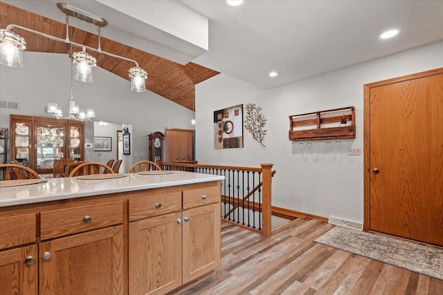 1502 Ridgewood Dr Unit D-7, West Bend, WI 53095 - kitchen featuring light wood-type flooring, a chandelier, light countertops, pendant lighting, and recessed lighting