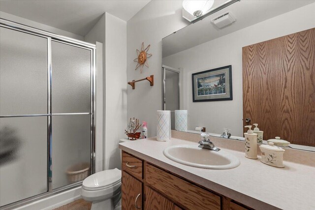 1502 Ridgewood Dr Unit D-7, West Bend, WI 53095 - full bathroom featuring a shower stall, toilet, and vanity