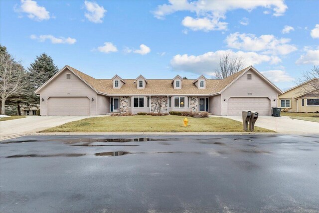1502 Ridgewood Dr Unit D-7, West Bend, WI 53095 - view of front of property featuring a garage, a front yard, and driveway