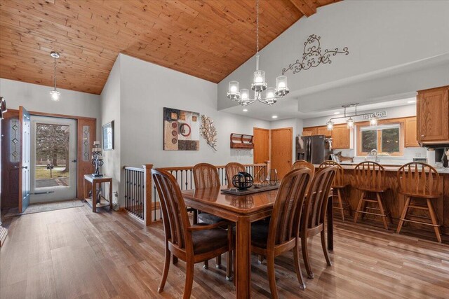 1502 Ridgewood Dr Unit D-7, West Bend, WI 53095 - dining space with high vaulted ceiling, light wood-style flooring, a chandelier, plenty of natural light, and wood ceiling