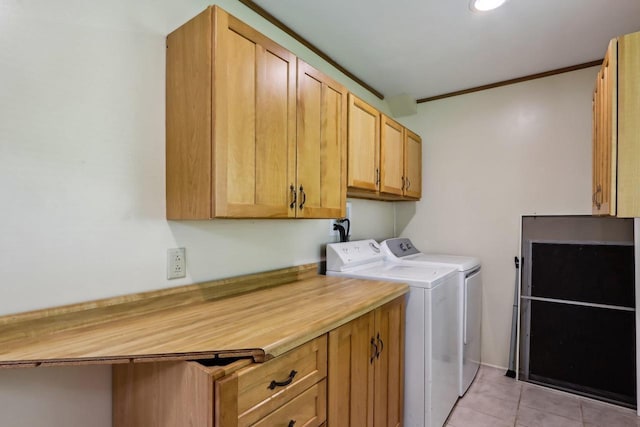 E14485 Baltic Ave, Merrimac, WI 53561 - laundry area featuring cabinet space, washer and dryer, light tile patterned floors, and crown molding