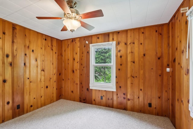 E14485 Baltic Ave, Merrimac, WI 53561 - unfurnished room featuring carpet flooring, wooden walls, and a ceiling fan