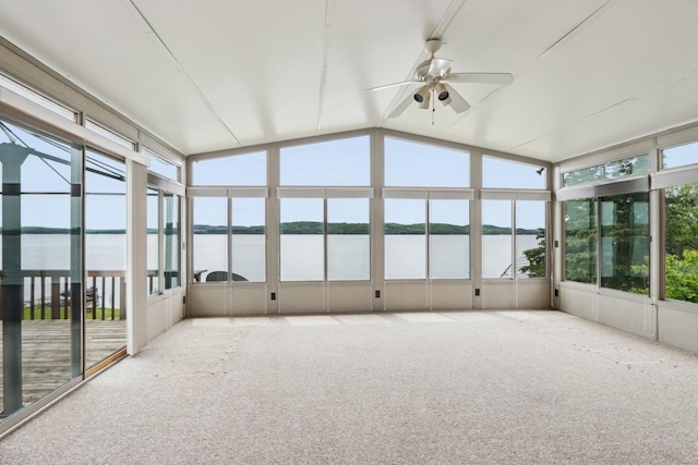 E14485 Baltic Ave, Merrimac, WI 53561 - unfurnished sunroom featuring a water view, ceiling fan, carpet flooring, and vaulted ceiling