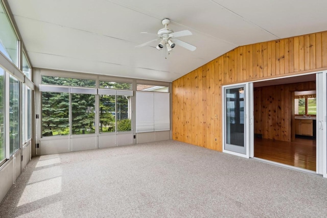 E14485 Baltic Ave, Merrimac, WI 53561 - unfurnished sunroom featuring vaulted ceiling, carpet floors, and wood walls