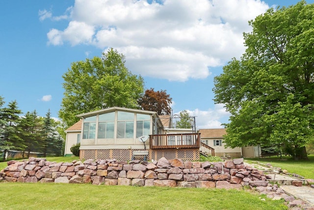 E14485 Baltic Ave, Merrimac, WI 53561 - rear view of property featuring a deck, a lawn, and a sunroom
