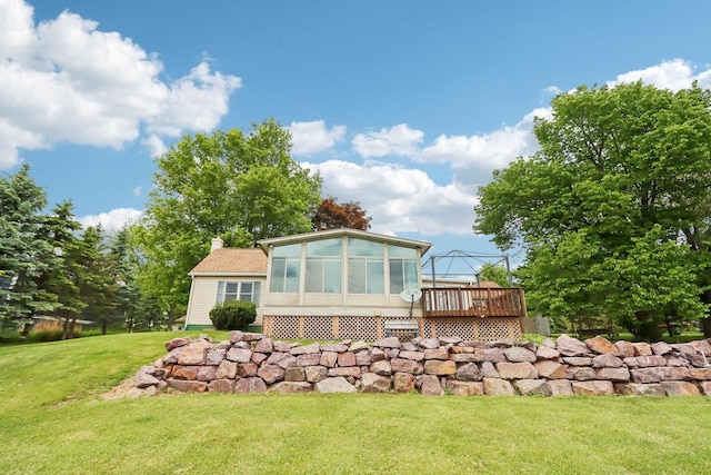 E14485 Baltic Ave, Merrimac, WI 53561 - back of house with a deck, a sunroom, a yard, and a chimney