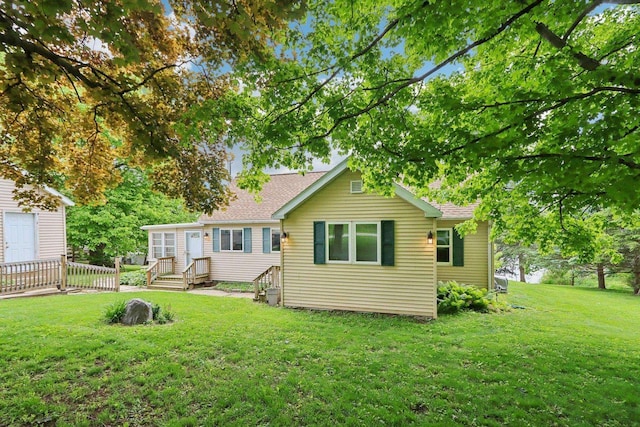 E14485 Baltic Ave, Merrimac, WI 53561 - rear view of house with a lawn and roof with shingles