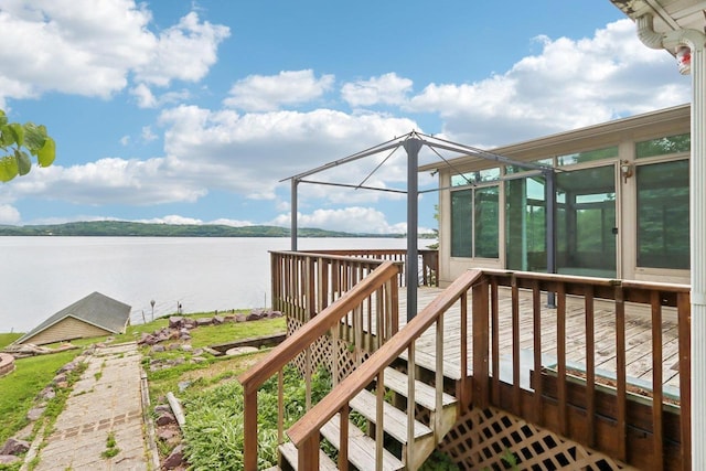 E14485 Baltic Ave, Merrimac, WI 53561 - wooden deck featuring a water view and a sunroom