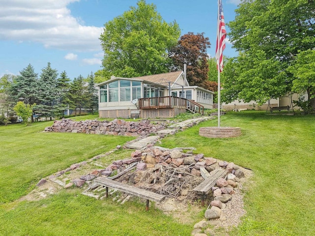 E14485 Baltic Ave, Merrimac, WI 53561 - view of grassy yard with a sunroom and a deck
