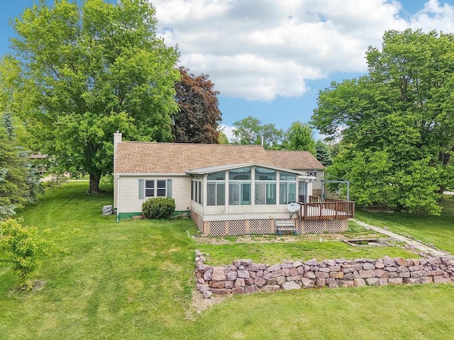 E14485 Baltic Ave, Merrimac, WI 53561 - back of property featuring a deck, a chimney, a sunroom, and a yard