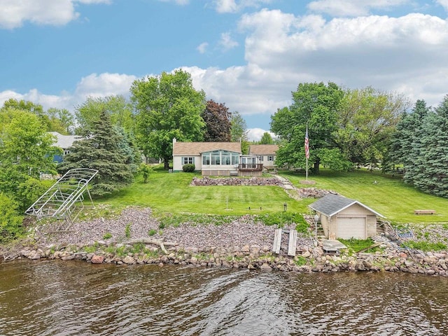 E14485 Baltic Ave, Merrimac, WI 53561 - back of property featuring an outbuilding, a lawn, a deck with water view, and a detached garage