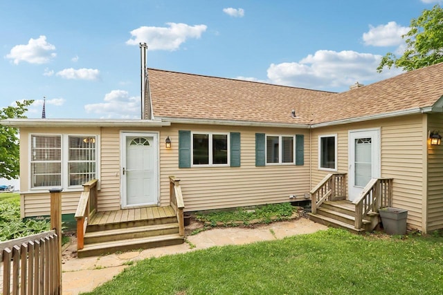 E14485 Baltic Ave, Merrimac, WI 53561 - rear view of property with a shingled roof and a lawn