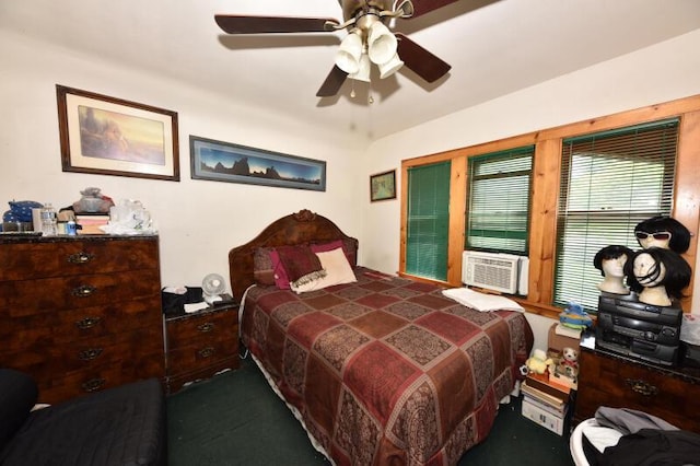 bedroom with cooling unit, a ceiling fan, and dark colored carpet