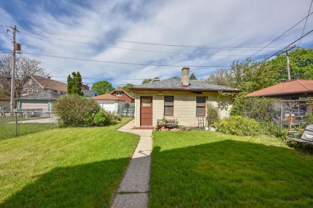 back of property with a chimney