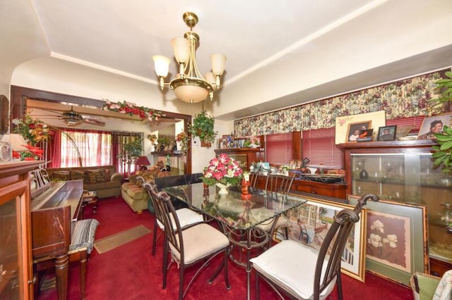 carpeted dining space featuring a ceiling fan