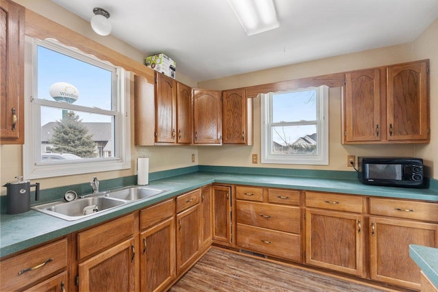 4084 Eagle Mound Pass, Deforest, WI 53532 - kitchen with a sink, black microwave, and brown cabinets