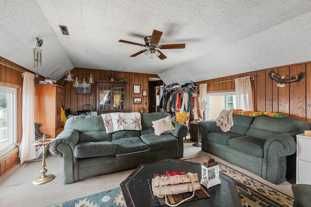 4084 Eagle Mound Pass, Deforest, WI 53532 - carpeted living room with wood walls, vaulted ceiling, and ceiling fan