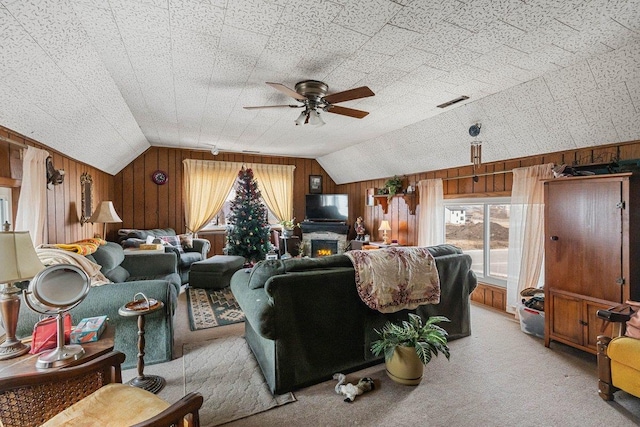 4084 Eagle Mound Pass, Deforest, WI 53532 - living room with lofted ceiling, light carpet, ceiling fan, and wooden walls