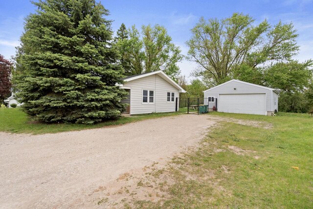 538 124th St, Franksville, WI 53126 - view of front facade featuring a detached garage and an outdoor structure