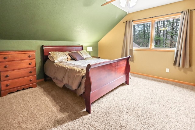 7496 River Rd, Lake Tomahawk, WI 54558 - bedroom featuring baseboards, lofted ceiling, carpet, and a ceiling fan