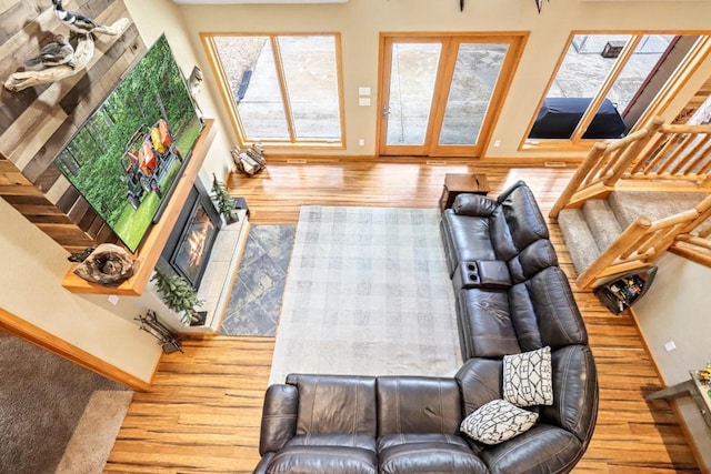 7496 River Rd, Lake Tomahawk, WI 54558 - living area with wood finished floors, baseboards, and a tile fireplace