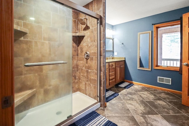 7496 River Rd, Lake Tomahawk, WI 54558 - bathroom with vanity, a stall shower, and baseboards