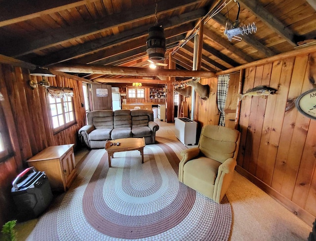 11586 Hidden Haven Dr, Hazelhurst, WI 54531 - living area with wooden walls, wooden ceiling, plenty of natural light, ceiling fan, and carpet flooring