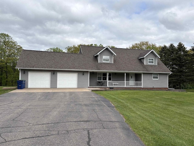 221545 Azalea Rd, Wausau, WI 54401 - cape cod home featuring asphalt driveway, an attached garage, a front lawn, a porch, and a shingled roof