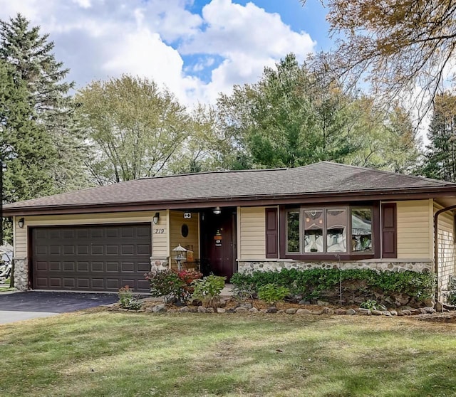 219 Park Ave, Eagle, WI 53119 - ranch-style home with stone siding, asphalt driveway, a garage, and a front lawn