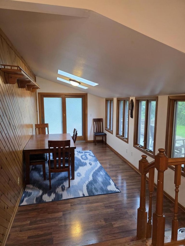 219 Park Ave, Eagle, WI 53119 - dining room with a skylight, wood finished floors, vaulted ceiling, and baseboards