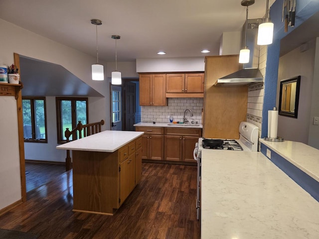 219 Park Ave, Eagle, WI 53119 - kitchen featuring wall chimney range hood, brown cabinetry, white gas range oven, dark wood-style flooring, and recessed lighting