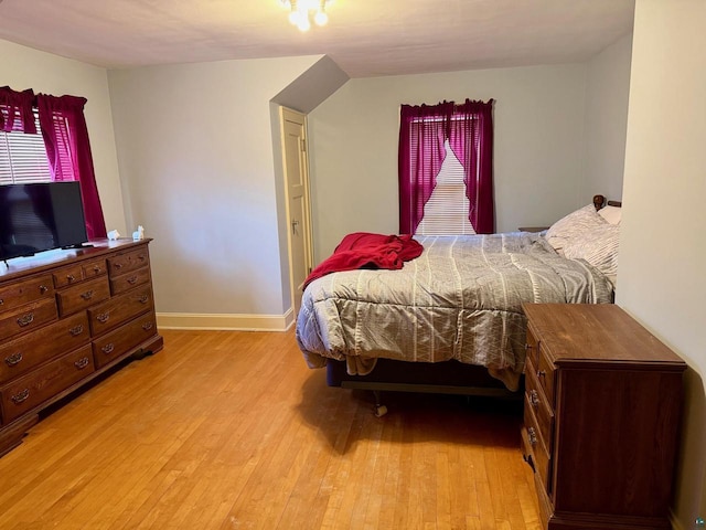 514 W 9th Ave, Ashland, WI 54806 - bedroom with light wood finished floors and baseboards
