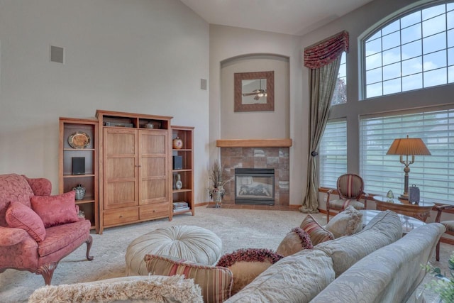 1826 Stonebridge Rd, Waukesha, WI 53188 - living room with high vaulted ceiling, light carpet, a fireplace, a ceiling fan, and baseboards