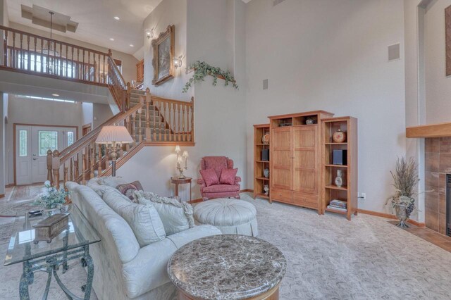 1826 Stonebridge Rd, Waukesha, WI 53188 - living room with a towering ceiling, stairway, a fireplace, baseboards, and recessed lighting